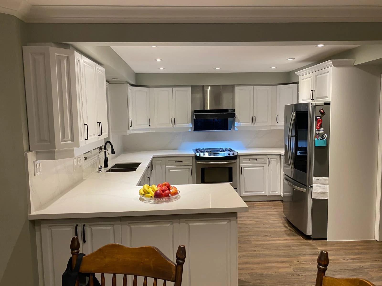 After: dark kitchen white cabinetry
