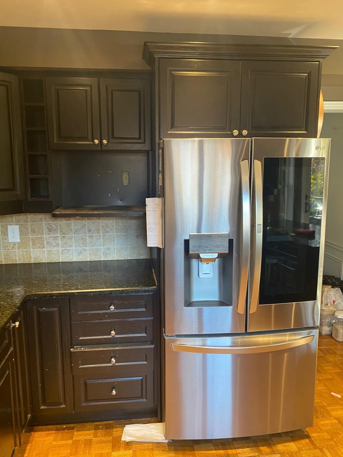 Before: dark kitchen white cabinetry