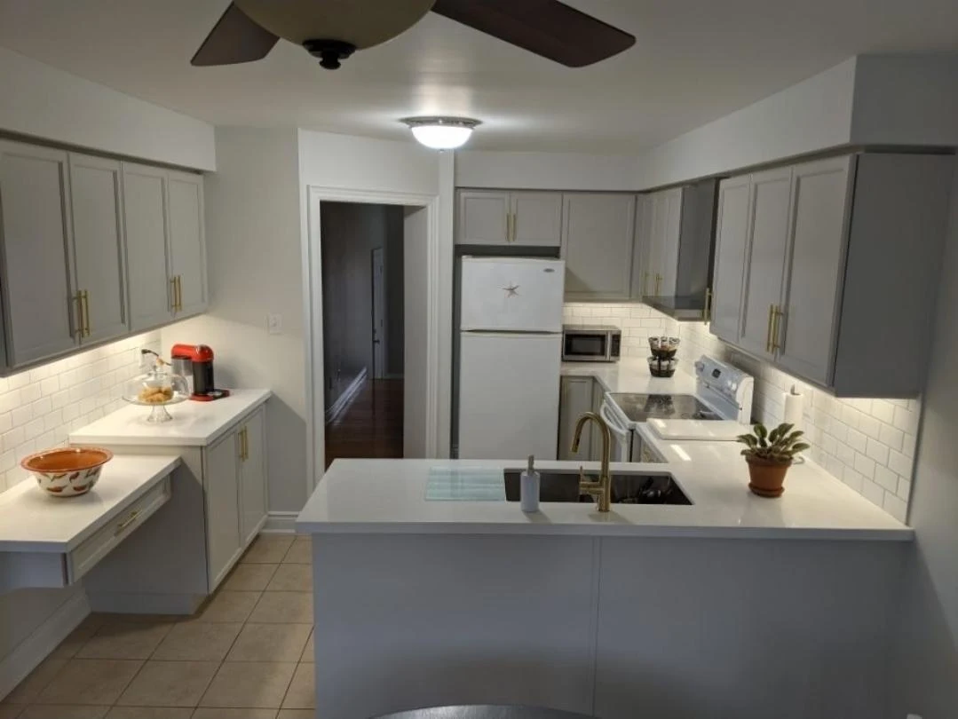 After: grey kitchen cabinetry