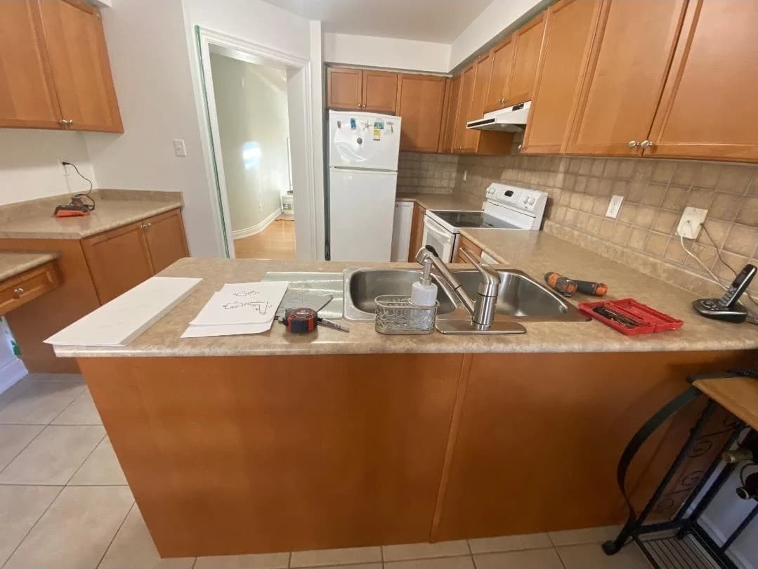 Before: grey kitchen cabinetry