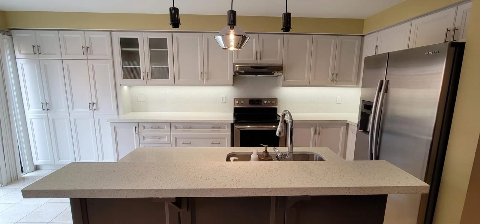 After: light kitchen cabinetry