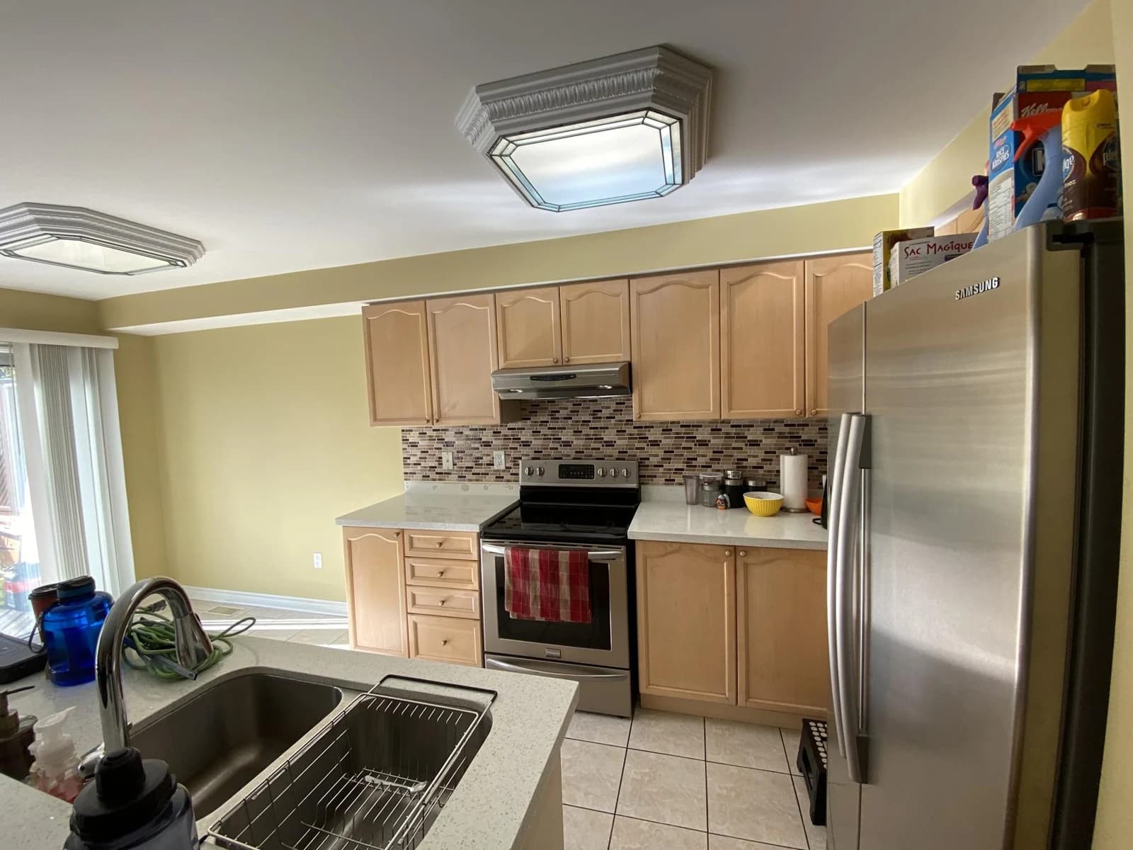 Before: light kitchen cabinetry