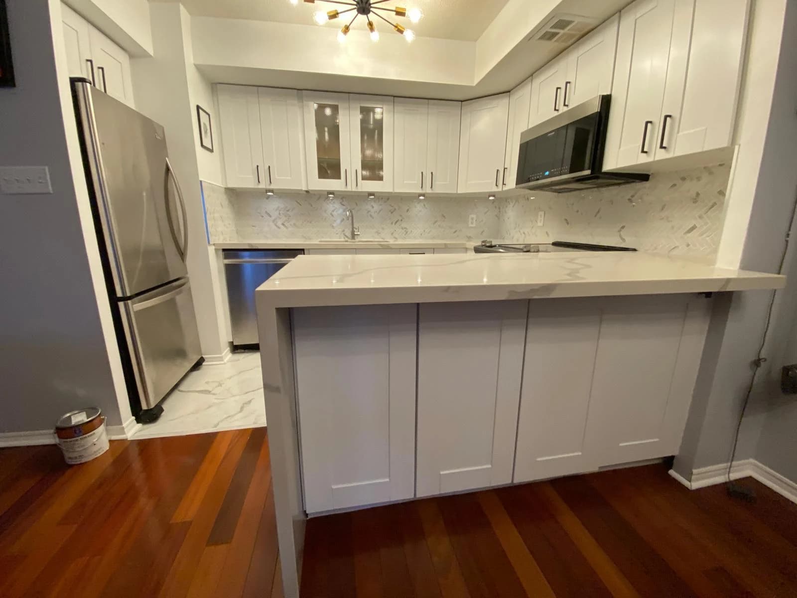 After: marble peninsula cabinetry