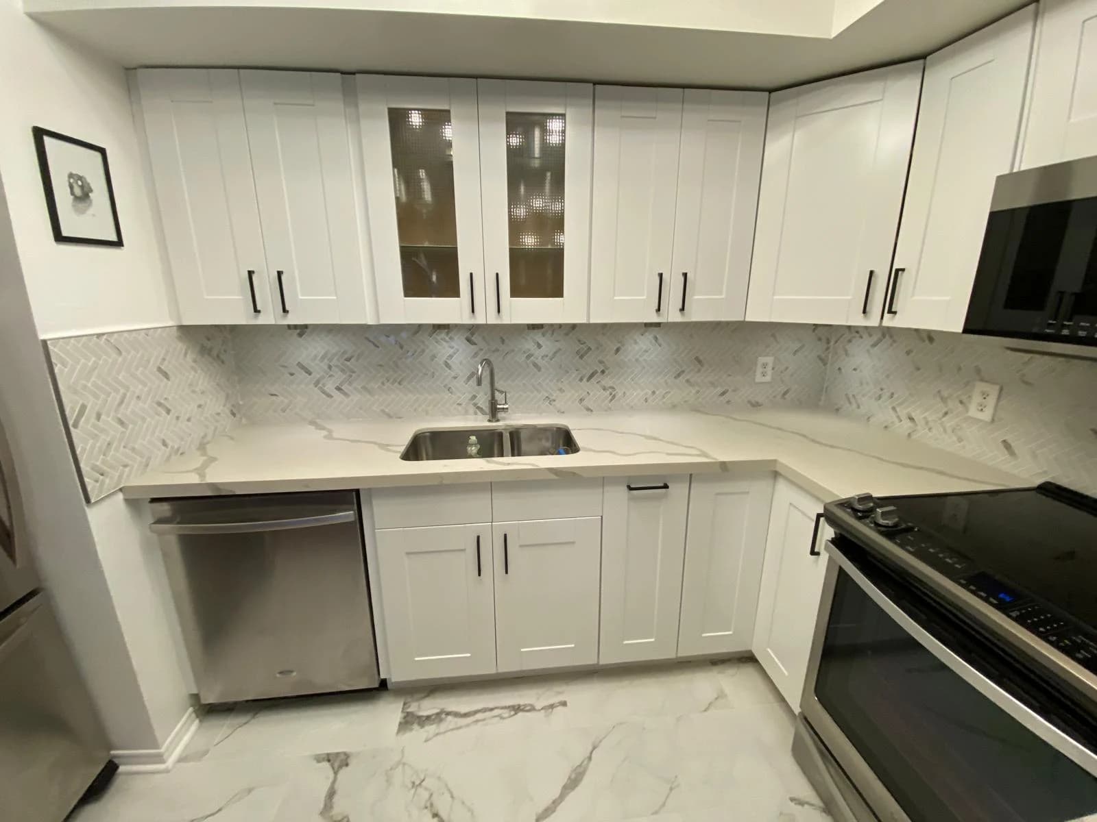 After: marble peninsula cabinetry