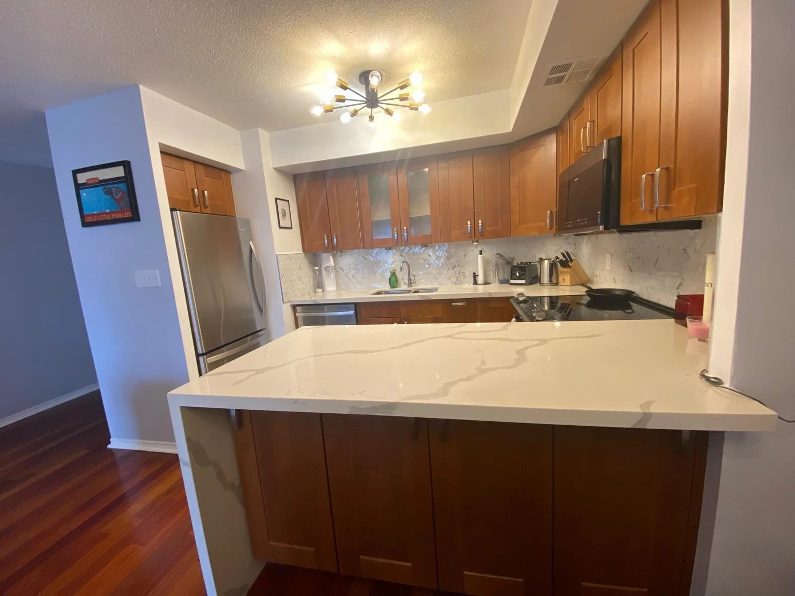 Before: marble peninsula cabinetry