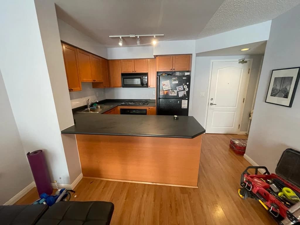 Before: wood peninsula cabinetry