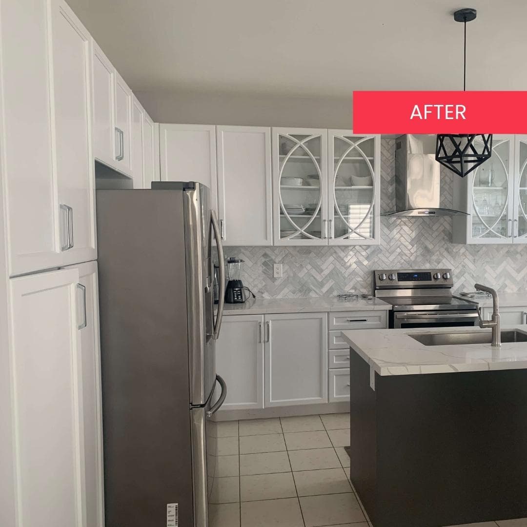 Open concept kitchen after white cabinet refinishing